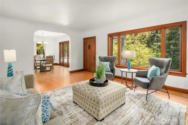 Coved archway connects dining room and living room