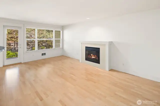 Living room with a wall of windows and fireplace