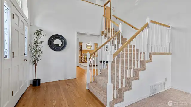 Charming hardwood floors set the tone for greeting, living and entertaining.