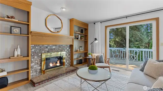 Family room with built-in bookcases and wood burning fireplace.