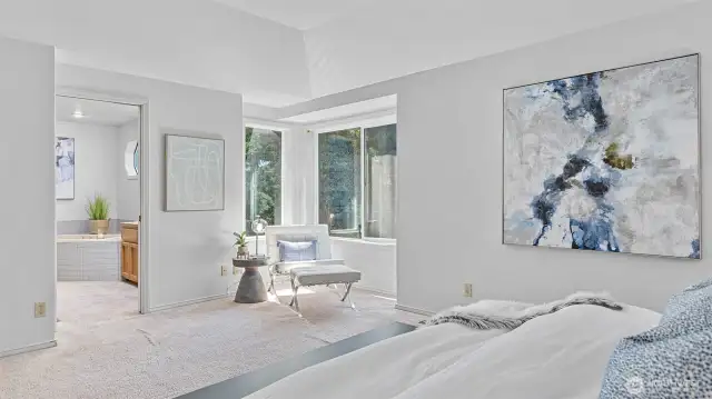 Another angle of the full of light Primary Bedroom with the view of the Primary Bath, a sitting room area.