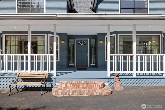 Charming entry with stained glass sidelight windows.