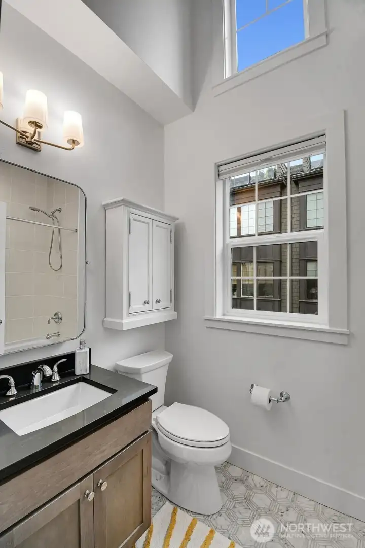 Vaulted ceiling family bathroom.
