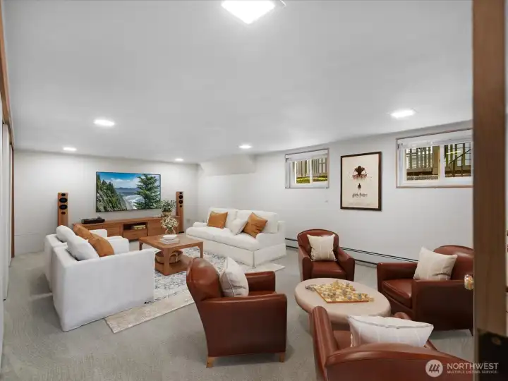 Large area in daylight basement has long wall of closets for excellent storage or use this room as a 5th bedroom!