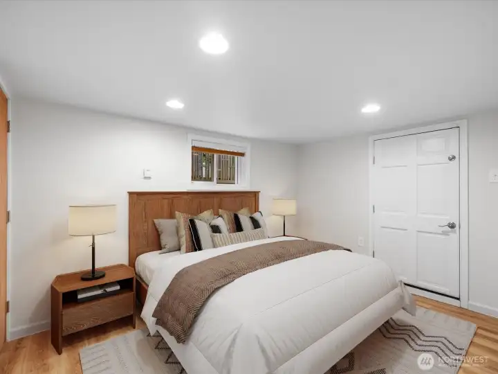 2 of 2 daylight basement bedrooms. This one has a closet, under stair storage, and access to back walkway.