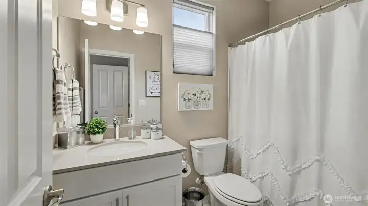 Guest bathroom with luxury vinyl flooring