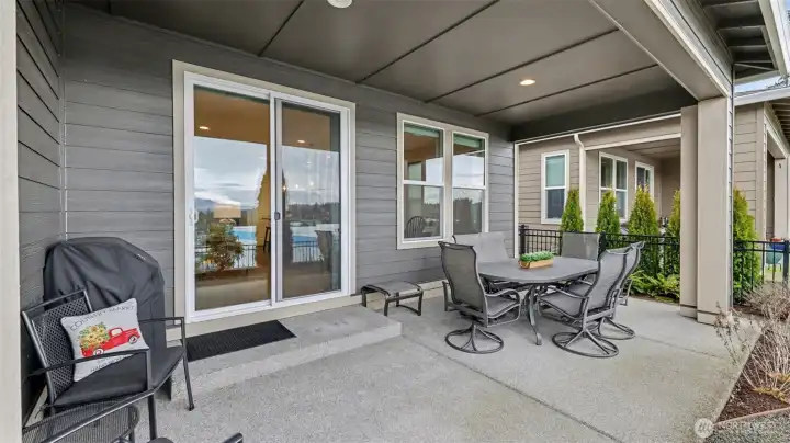 Step outside to the covered concrete patio, an inviting space to start the day with coffee or unwind in the evening while taking in mountain views and fresh air