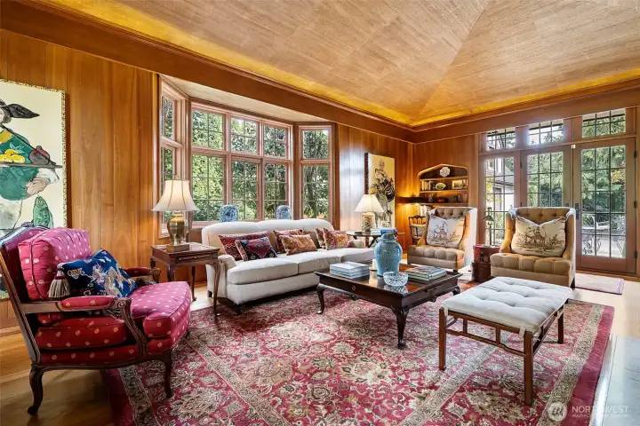 The newly installed French doors effortlessly unite the expansive outdoor living space with the refined interior, creating a seamless flow between indoors and out.