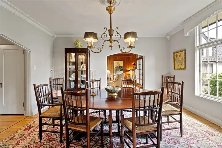 This elegant, expansive dining space accommodates numerous guests while preserving a refined ambiance that elevates every celebration.