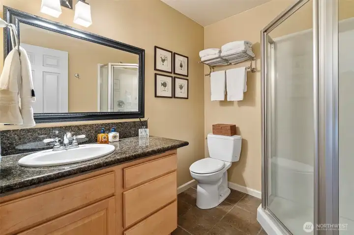 High-functioning three-quarter bath on the main level, perfect for quick cleanup after a day in the garden.