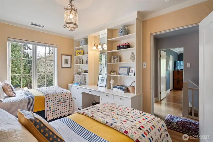 At the top of the stairs, this bedroom exudes charm from every detail.