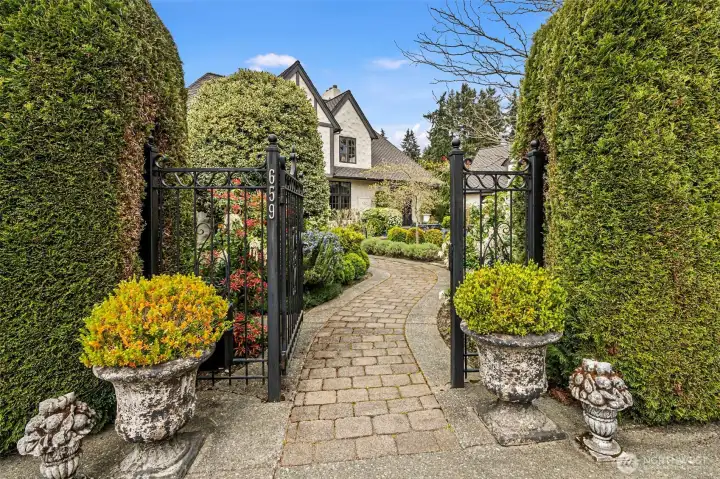 Alley access to garage and parking pad - enter through these gates.