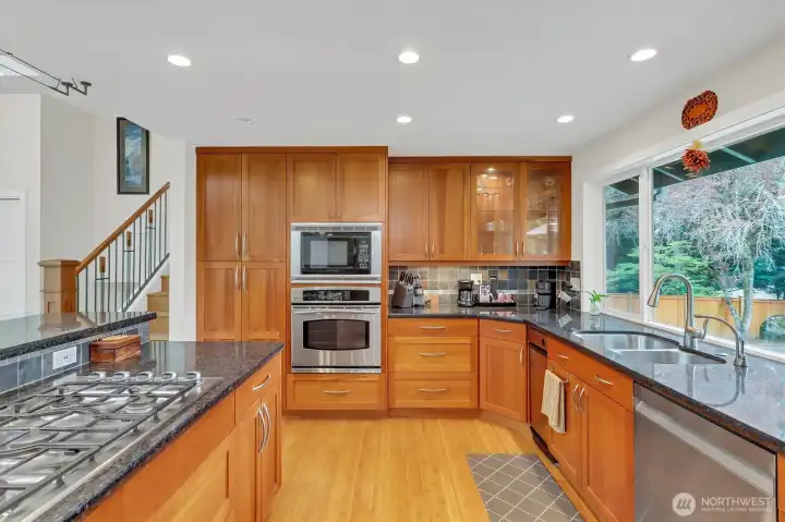 Stainless appliances and gas cooktop.