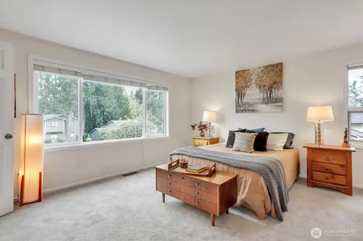 Spacious primary bedroom with lots of light.