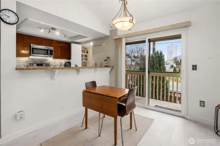 Dining Area wi/ slider door to private balcony.