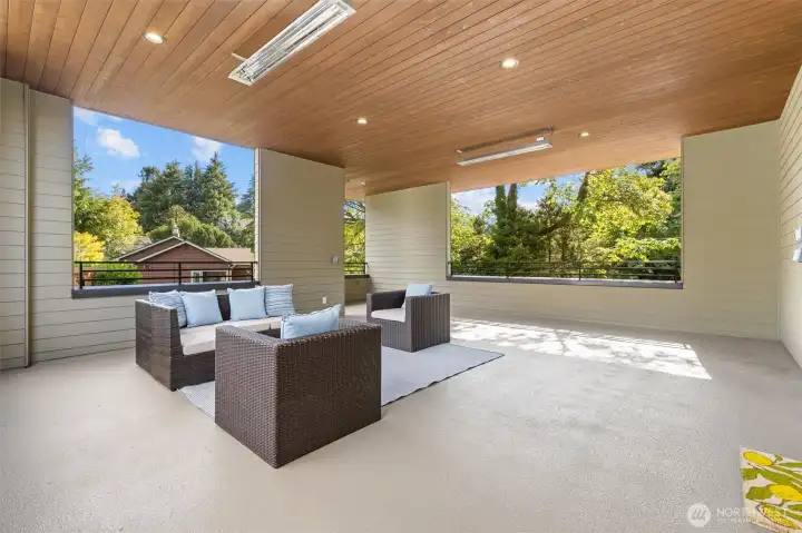 With dual overhead heat lamps and a staircase down to the back grounds and original garage.