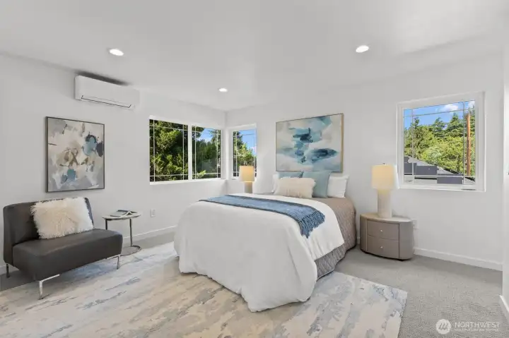 Top floor has a Primary Suite, 2 more bedrooms, a rec room and utility room.