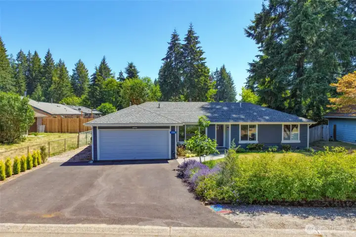 Pride of ownership begins with the newer paved driveway, roof, concrete walk to the entry and the picture perfect gardens both in the the front and back. Pride of ownership begins with the newer paved driveway, roof, concrete walk to the entry and the picture perfect gardens both in the the front and back.