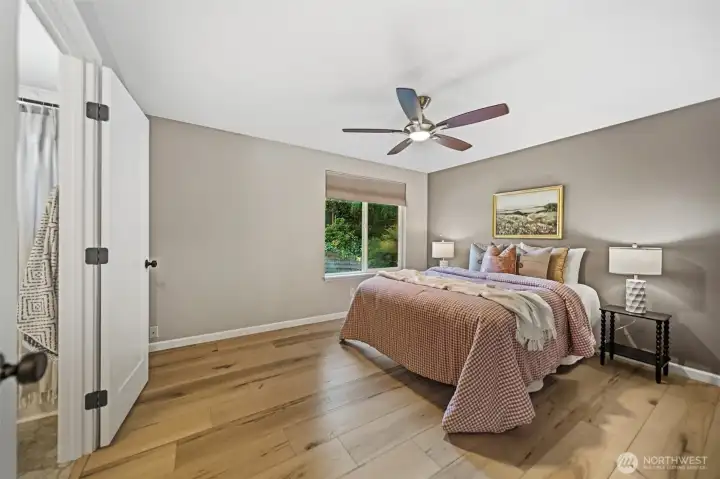 Primary showing access to main bath. Very tastefully done with upgraded floors, doors, lighting and paint. Primary showing access to main bath. Very tastefully done with upgraded floors, doors, lighting and paint.