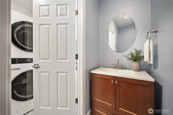 Half bath off conveniently situated between garage and family room. Half bath off conveniently situated between garage and family room.