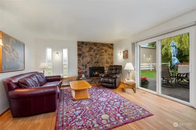 The family room features a gas fireplace and sliding doors that open to the patio and backyard.