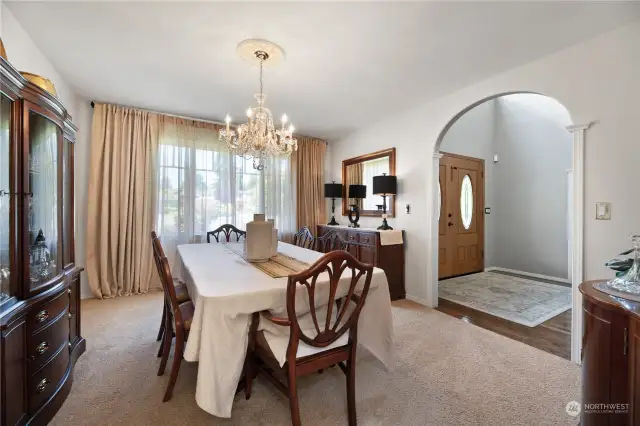 Formal dining room is elegant and welcoming.