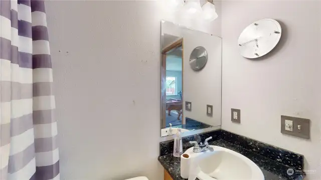 updated bath room with shower, located downstairs