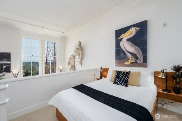 Mezzanine Bedroom with Custom Built-In Bed and Side Tables