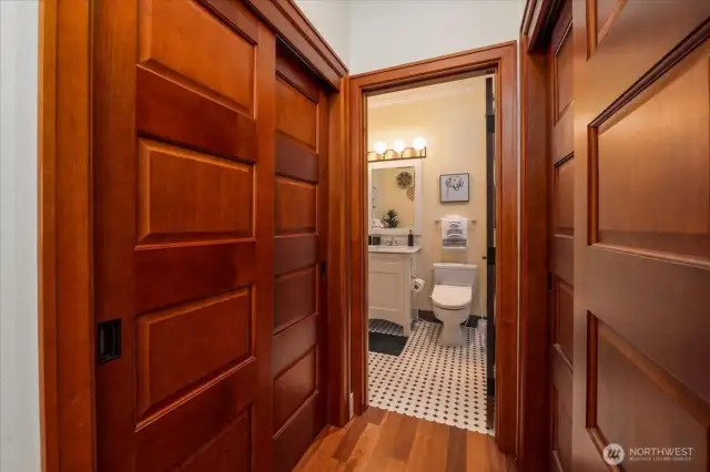 Thoughtfully Designed Hallway with Wardrobes on Both Sides and In-Unit Laundry Hookup