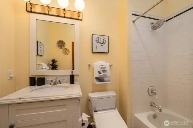 Beautifully Appointed Full Bathroom Offering Style and Functionality