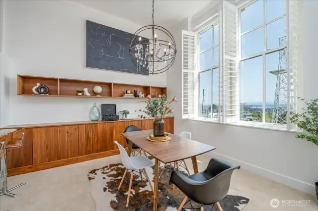 Scenic Dining Area Featuring a Custom Built-In Credenza and Floating Wall Shelf
