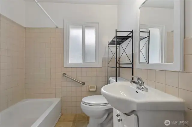 Full hall bathroom on the original side of the home