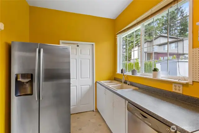 Additional view of the second kitchen. The door behind the refrigerator leads to the original home side.