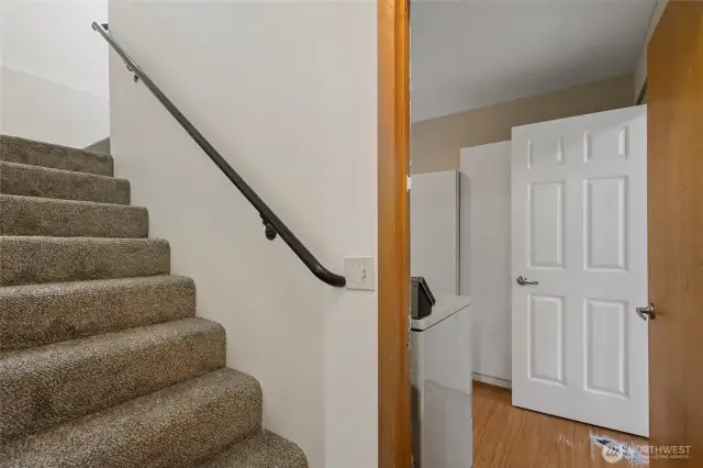 Stairs leading to 2 bedrooms and a full bathroom on the upper level of the 2nd side