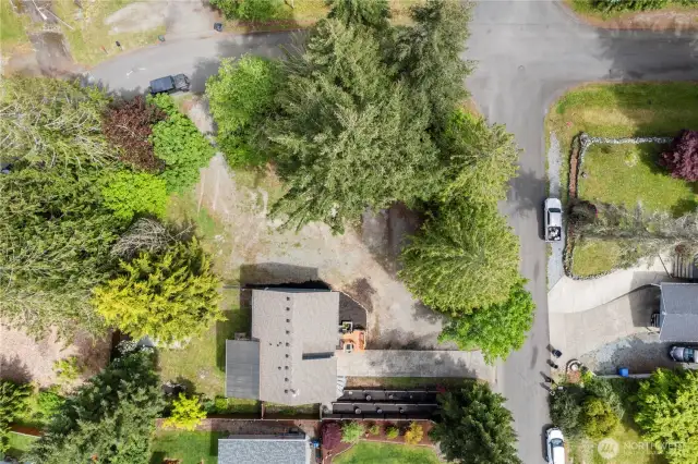2nd driveway in the upper left hand corner and main driveway lower right hand corner. See the beautiful terraced area next to the driveway.