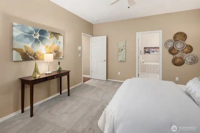 The primary bedroom boasts a private bath and a walk-in closet.