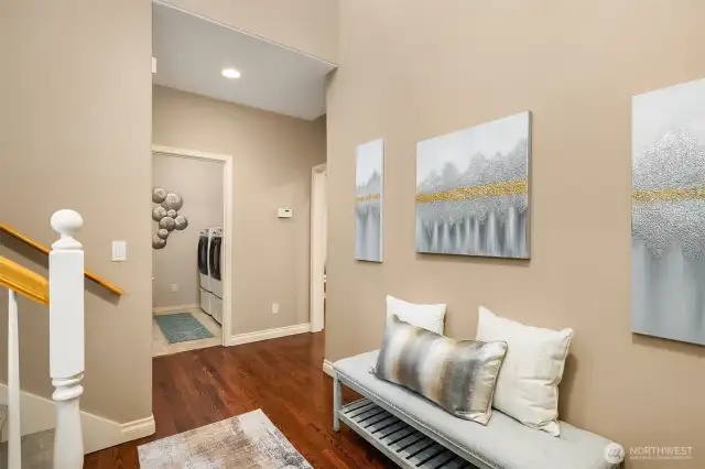 Front entry with beautiful hardwood floors that flow through the hallway and into the kitchen.