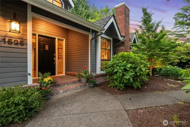 mature landscaping to covered porch - refurbished brick chimney