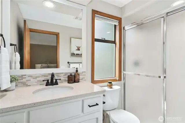 ensuite: walk in shower, quartz countertop and tiled floors
