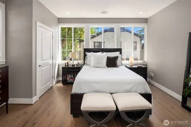 Two oversized closets feature custom built-in storage, providing ample space and organization for all your wardrobe needs.