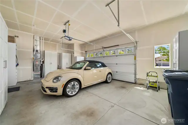A coveted 2.5+ car garage with tons of natural light, a plethora of space for storage, tall ceilings and a handy service door.
