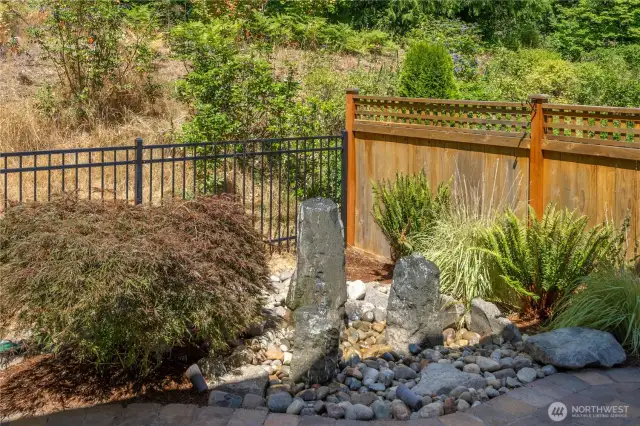 Relax on your back patio listening to the tranquil water feature.