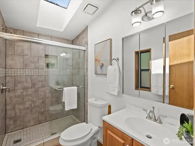 Primary bathroom with tiled shower
