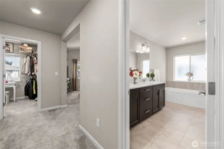 Large walk-in closet to your left, master bedroom in the middle, and master bath to the right