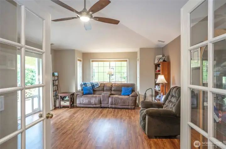 Step through double doors into a comfortable, light-filled family room.