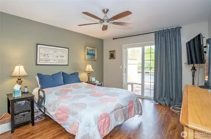 Luxurious primary suite features a private deck entrance—perfect for morning coffee or evening unwinding.