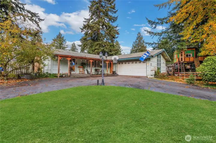 Front of home. Lot's of parking, room for small RV.