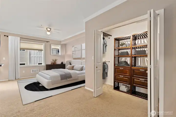 Virtually staged pic of the master bedroom.  Very Very Spacious with custom built in the closet.  Lots of space and door leading to the private patio.