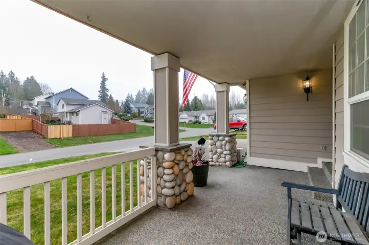 Inviting covered porch with sitting area