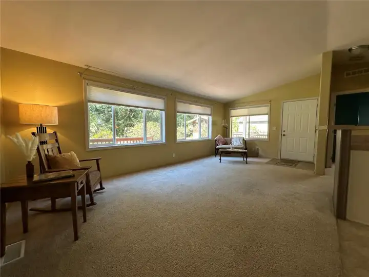 Spacious living room overlooking deck